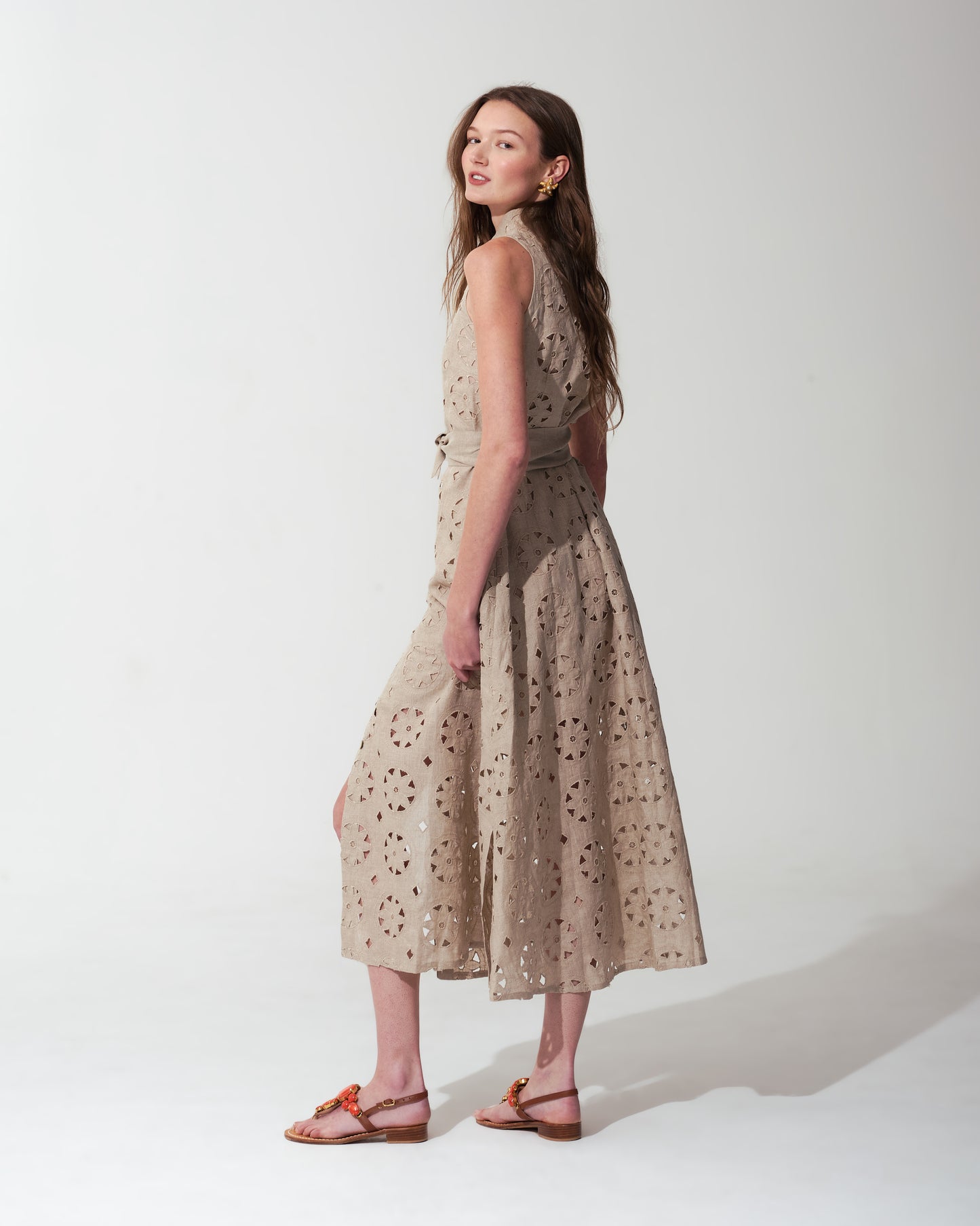 Woman wearing a Sand floral dress on a background