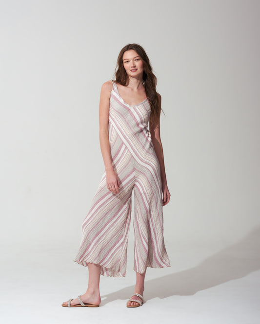 Woman wearing a striped pink dress on a white background